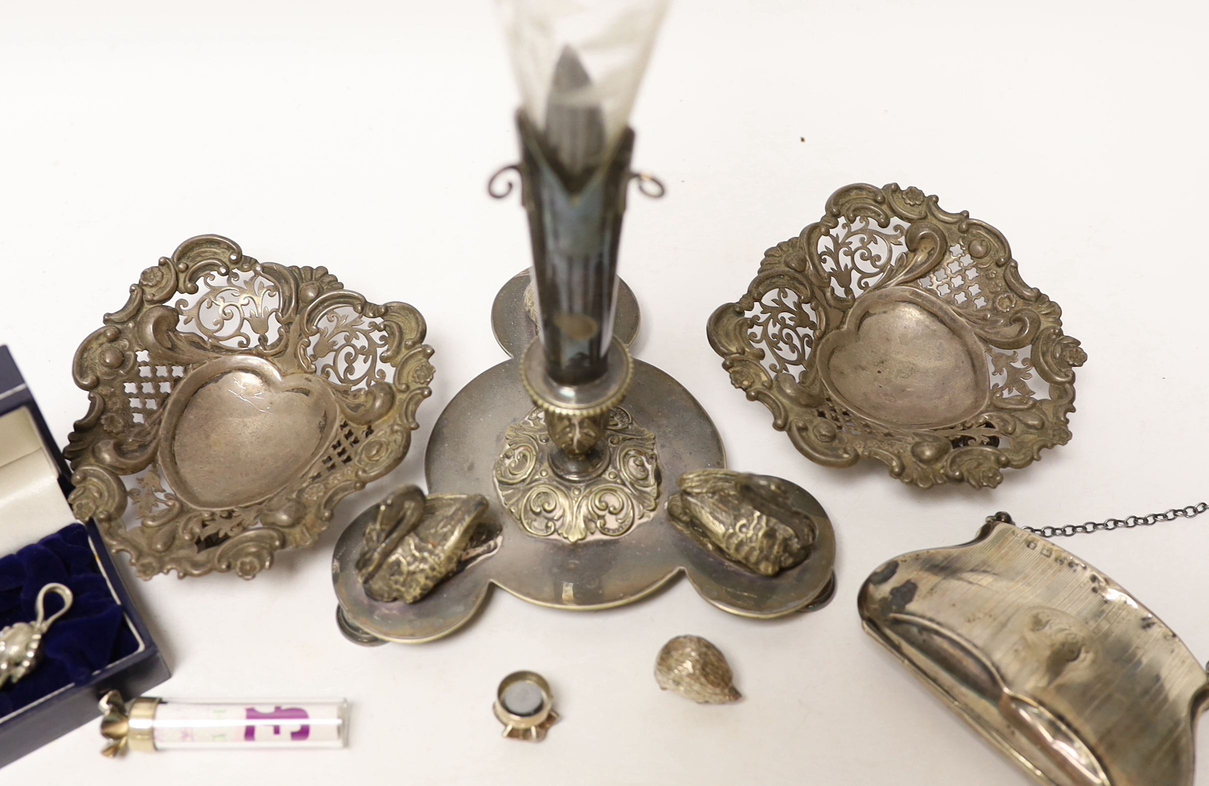 A pair of Edwardian pierced silver bonbon dishes, four other modern silver items and a plated centrepiece with glass vase.